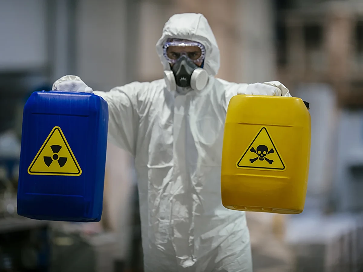 Biohazard cleanup technicians in protective equipment at a remediation scene in Van Buren, AR